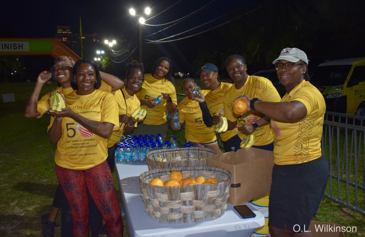 Team members staffing the fruit and hydration station at the finish