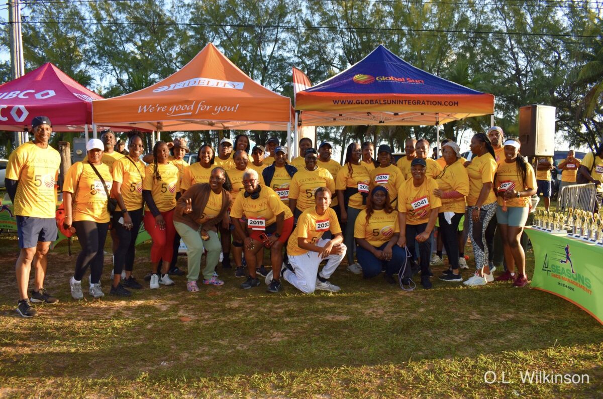 The Global Sun Integration team gathered at the company tent for the Banker's Athletic Association Fun Run Walk