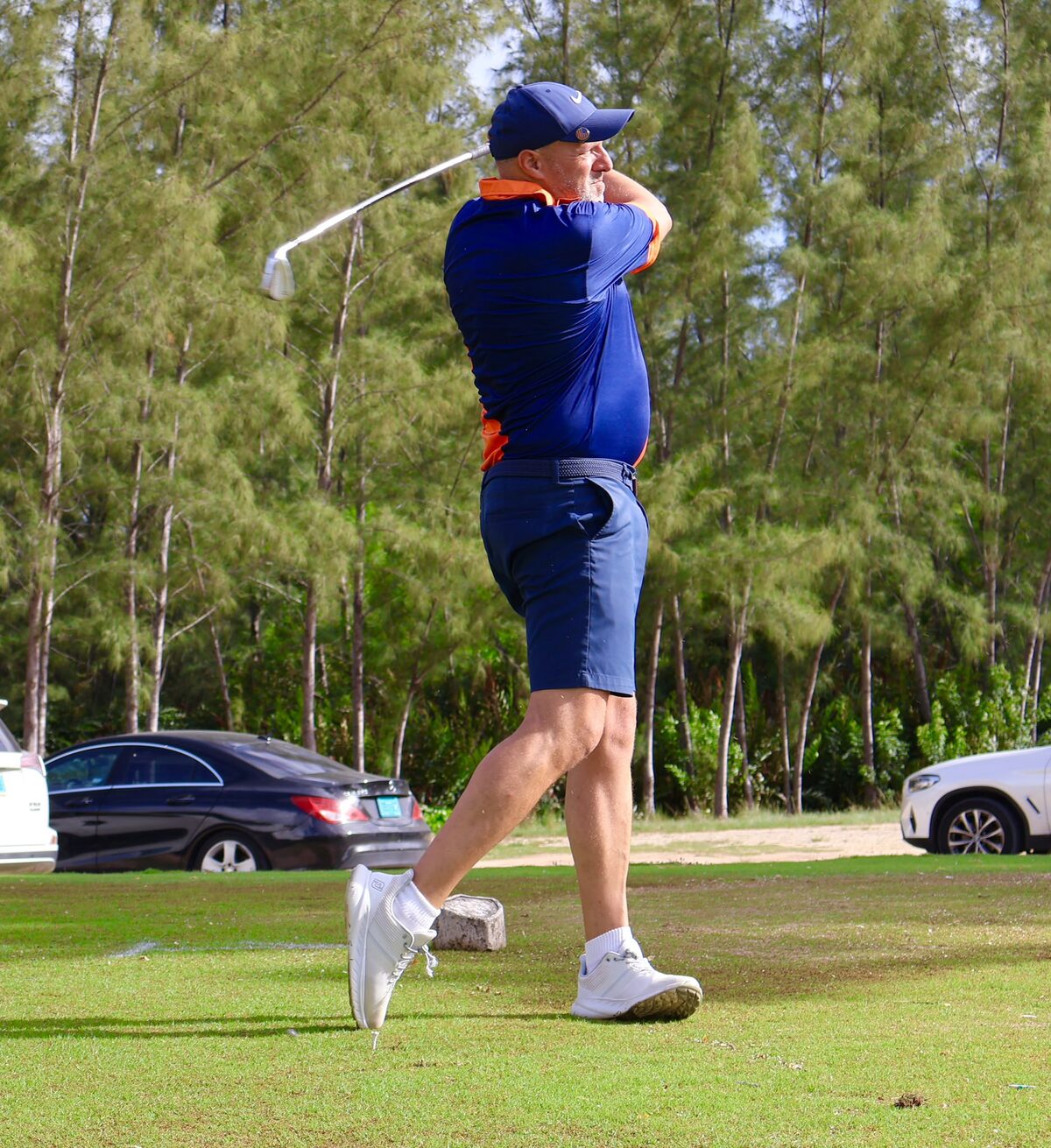 A Global Sun Integration player follows through on a drive from the tee