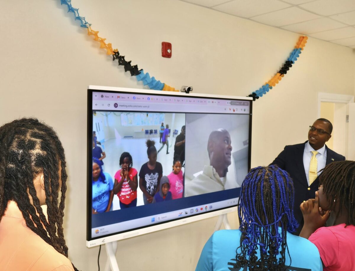 Students watch a live video call demonstration on the new interactive board