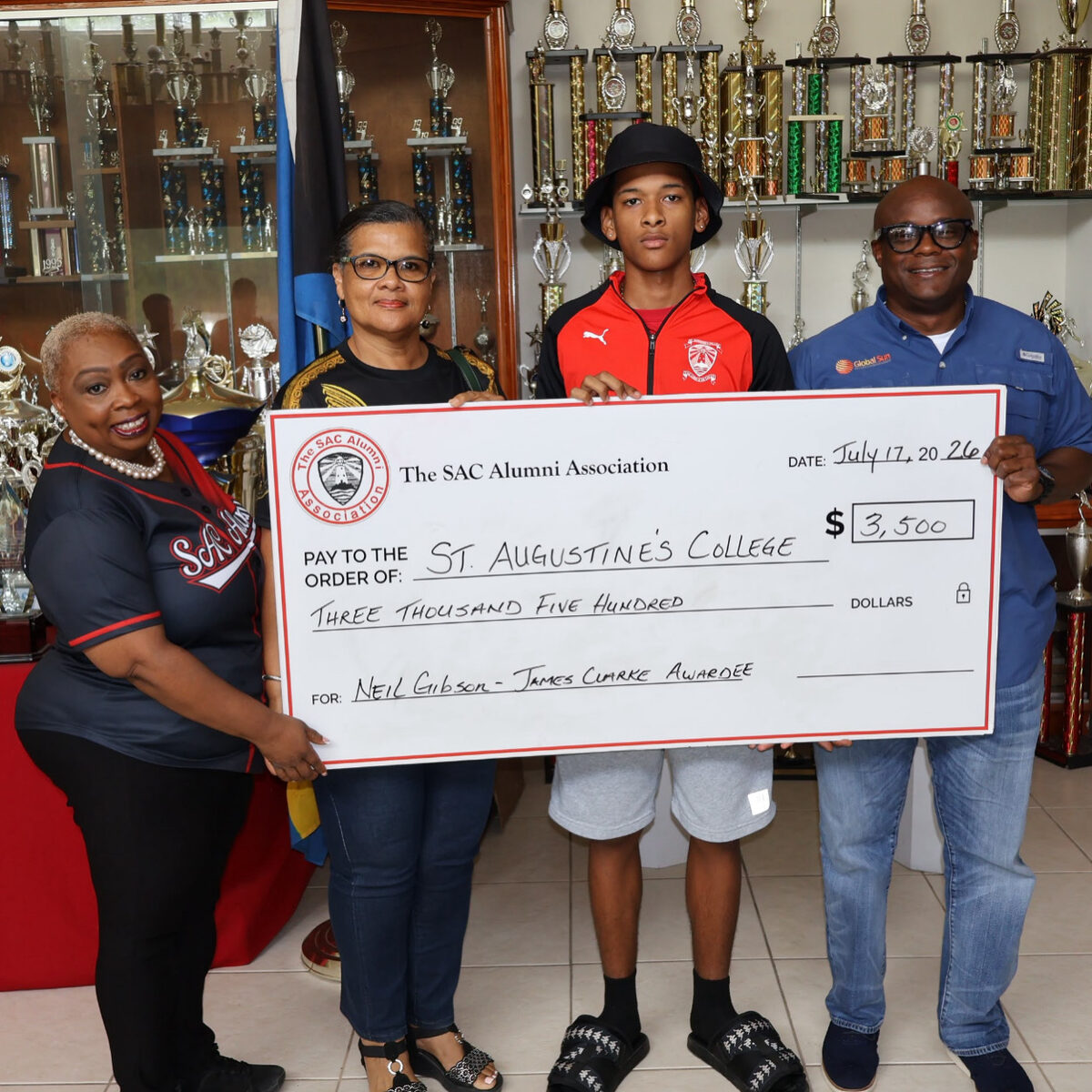 Scholarship recipient Neil Gibson receives the $3,500 SAC Alumni Association cheque alongside GSIM CEO James Clarke and SAC Alumni representatives